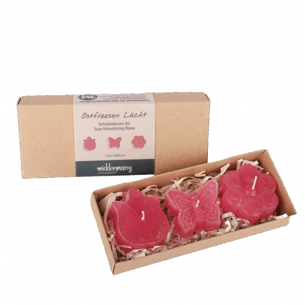 Drei Schwimmkerzen in Form von Tulpe, Schmetterling und Blume in der Farbe Bubblegum in einer Verpackung aus Pappe.